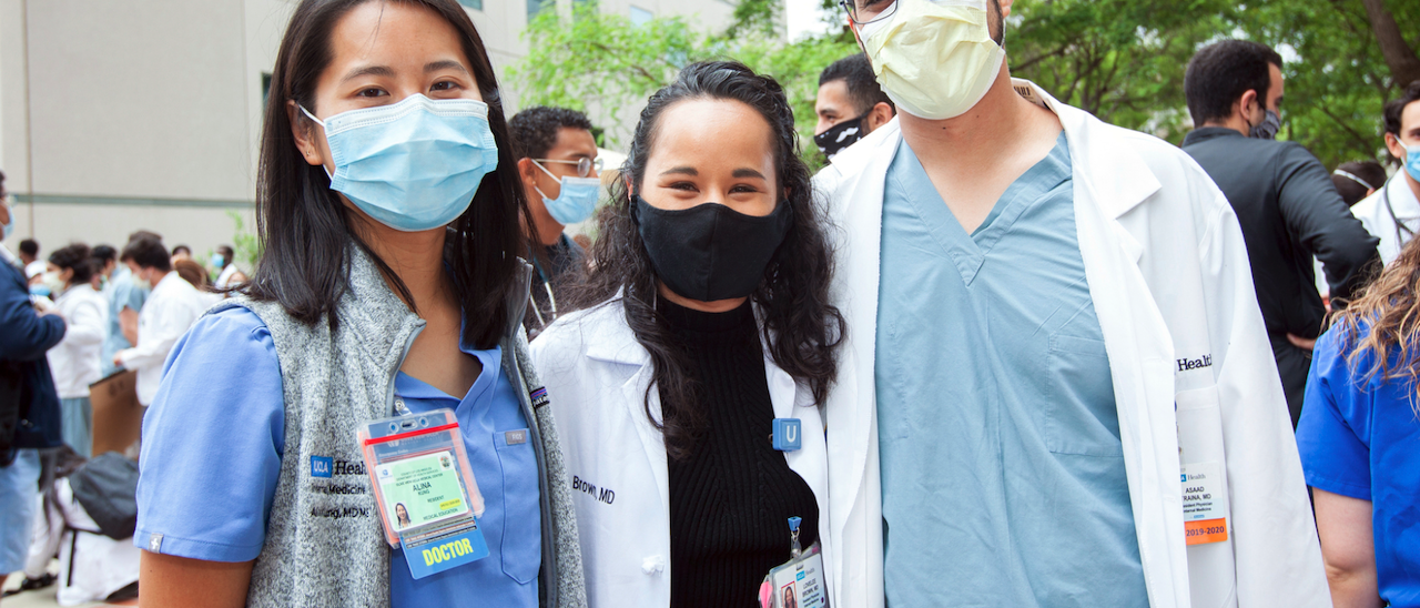 Three doctors pictured at a UCLA Health day of solidarity with the BLM movement