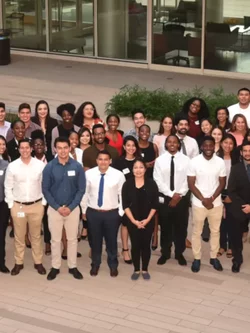 A group of pre med SHPEP, PREP and RAP alumni in the Geffen Hall courtyard at UCLA