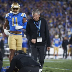 Sports medicine physician helping a UCLA football player 