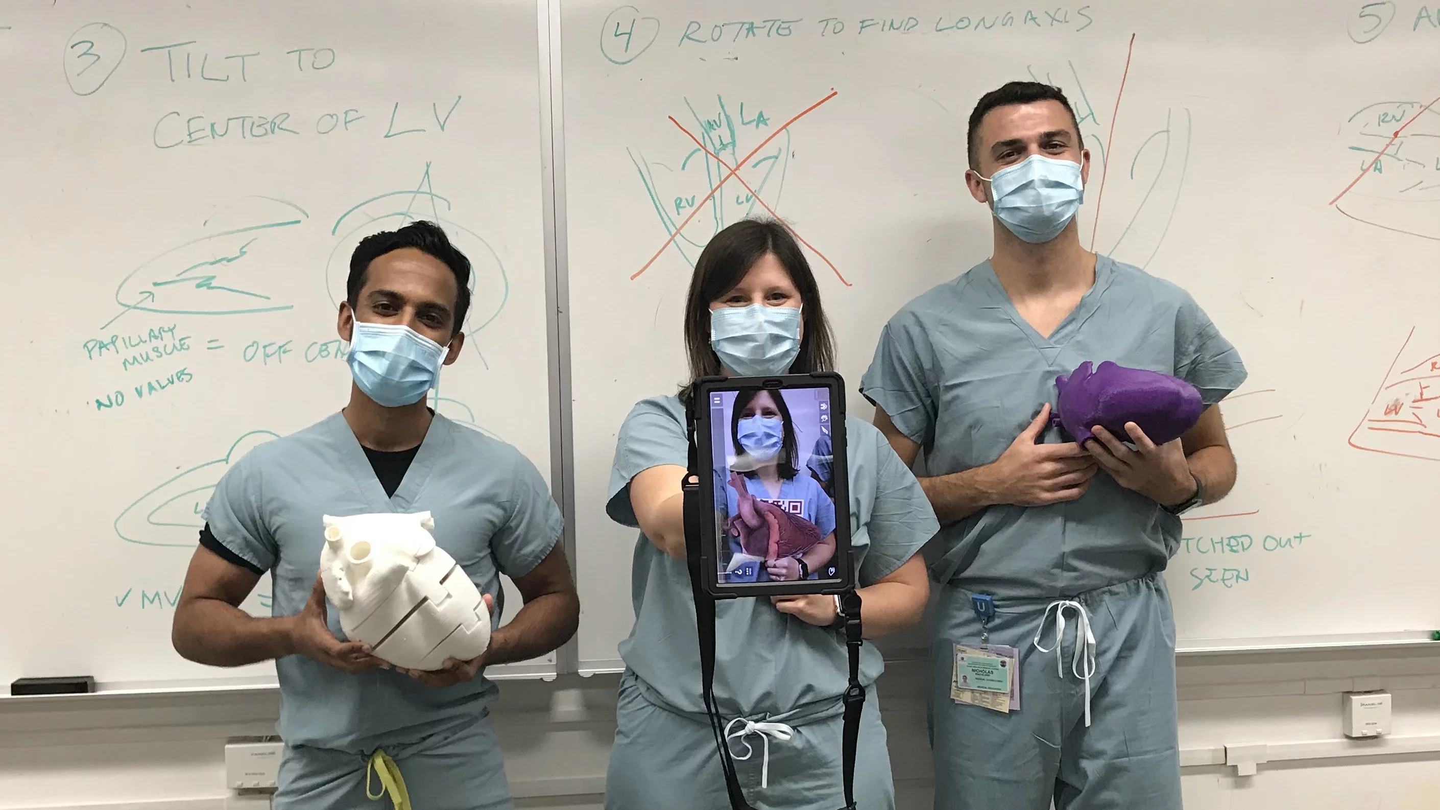 Students posing with POCUS technology
