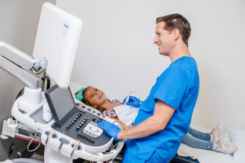 Pediatrician treating child