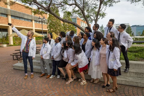 A group of medical students take a selfie at the Gold Humanism Honor Society induction ceremony.