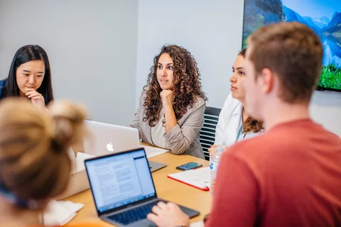 Medical school student on laptop in class