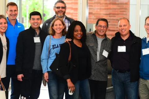 group of people standing at a UCLA medical school event