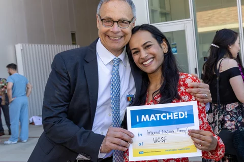 Dr. Lee Miller, associate dean of student affairs, congratulates medical school student, Aloukika Shah, on her internal medicine match to UCSF.