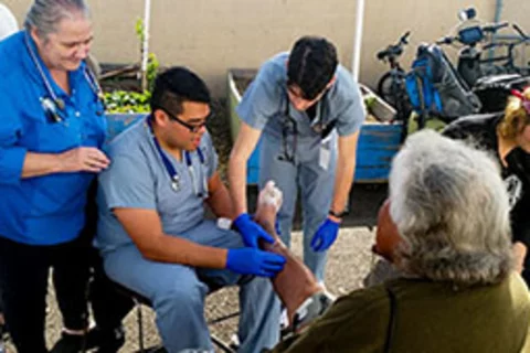 UCLA medical students, under the supervision of attending Dr. Mary Marfisee, providing foot care at Samoshel.