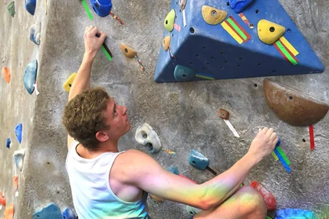 Man climbing on rock wall