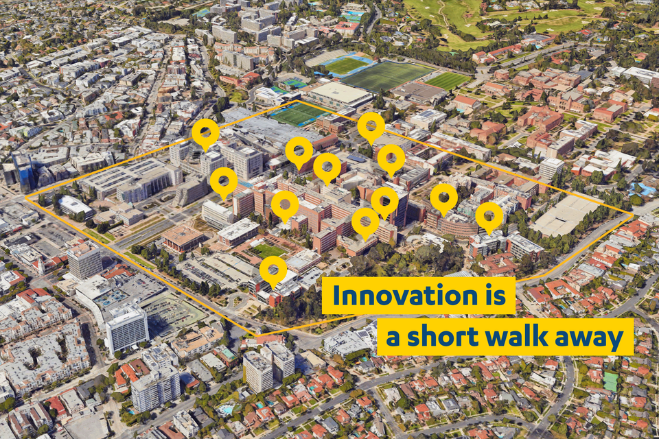 Aerial shot of campus with many innovation hubs marked to show how close potential partnerships are. The phrase, 'innovation is a short walk away' is superimposed