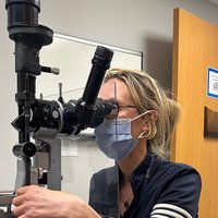 Ophthalmologist Dr. Jo Ann Giaconi using lab equipment 
